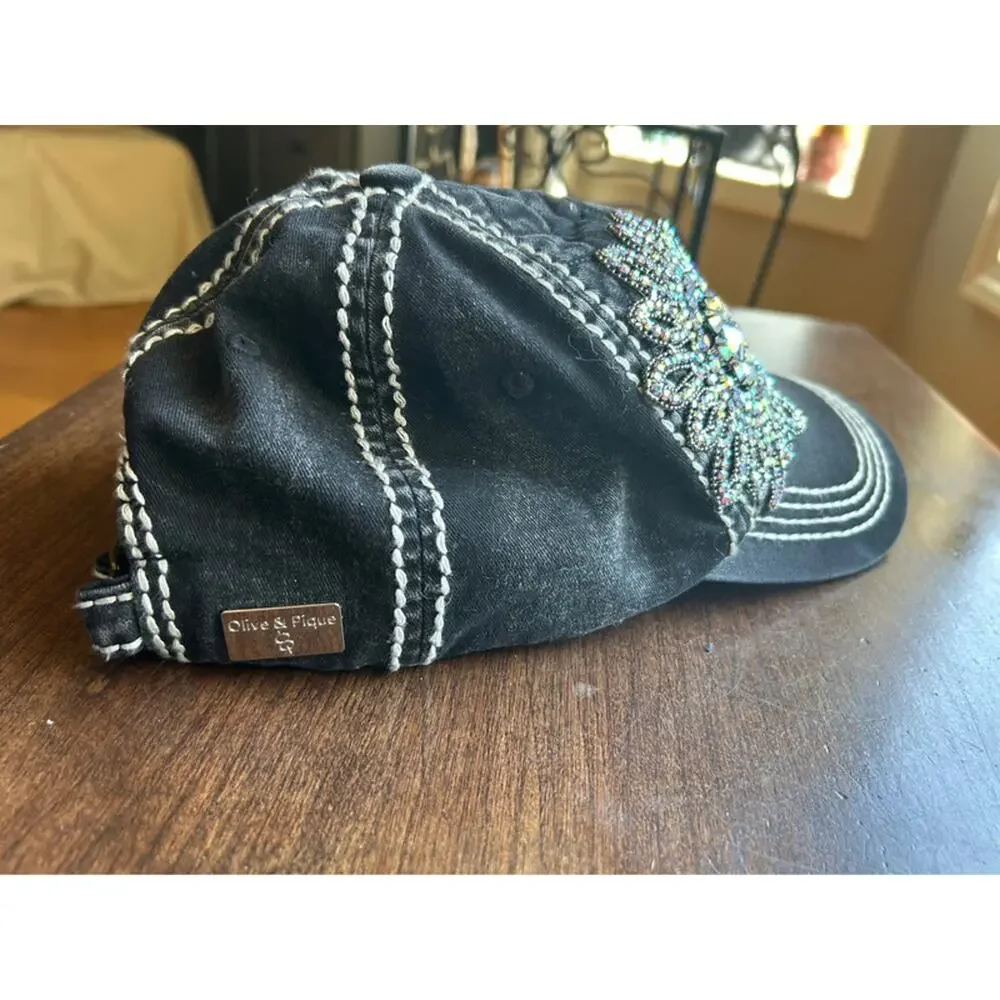 Olive & Pique quilted baseball cap featuring an iridescent rhinestone flower
